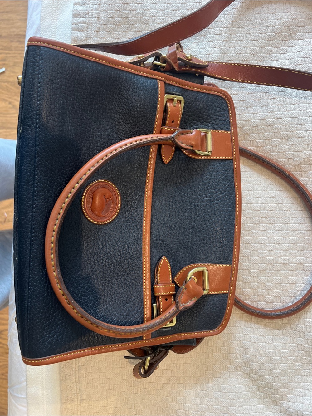 Dooney & Bourke Black Leather Satchel with Brown Trim and Brass Hardware
